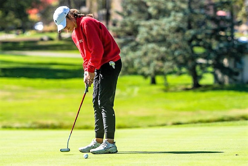 Grand Blanc’s Kate Brody, here following through on a putt, has posted a tournament personal best 62 this season.
