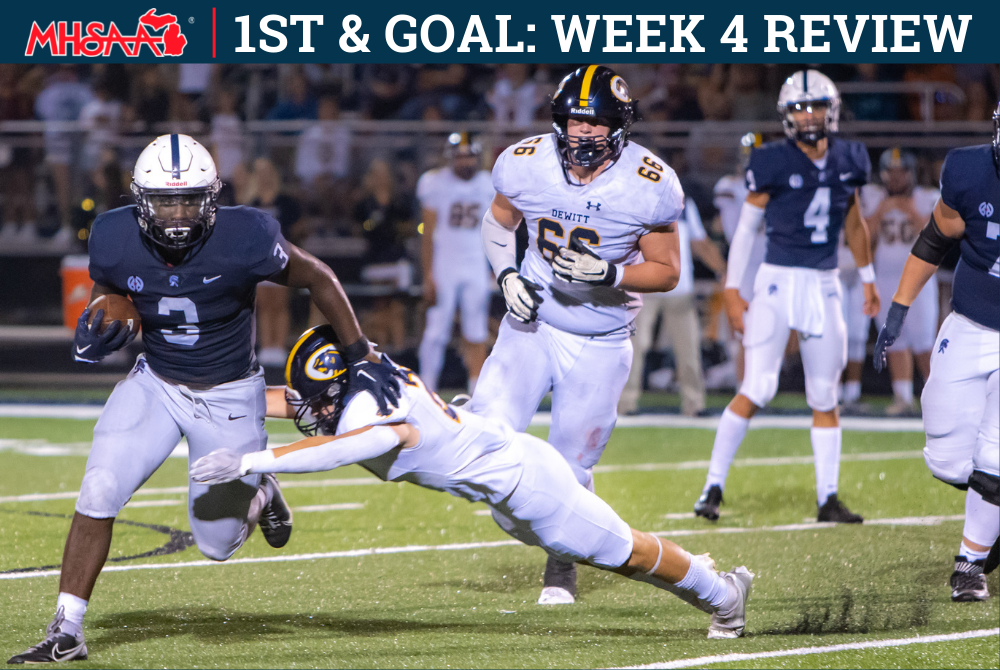 An East Lansing ball carrier (3) works to break away from a DeWitt tackler.