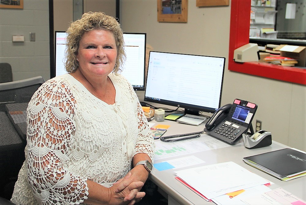 Rhonda VanderKamp sits at her desk as she begins her 21st year in the Vicksburg athletic department. 