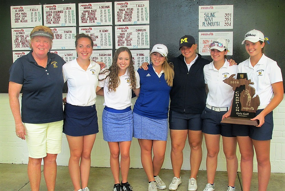 Saline golf coach Debbie Hoak-Williams, far left, stands for the trophy shot with her girls team after the Hornets won the 2016 Lower Peninsula Division 1 championship. 