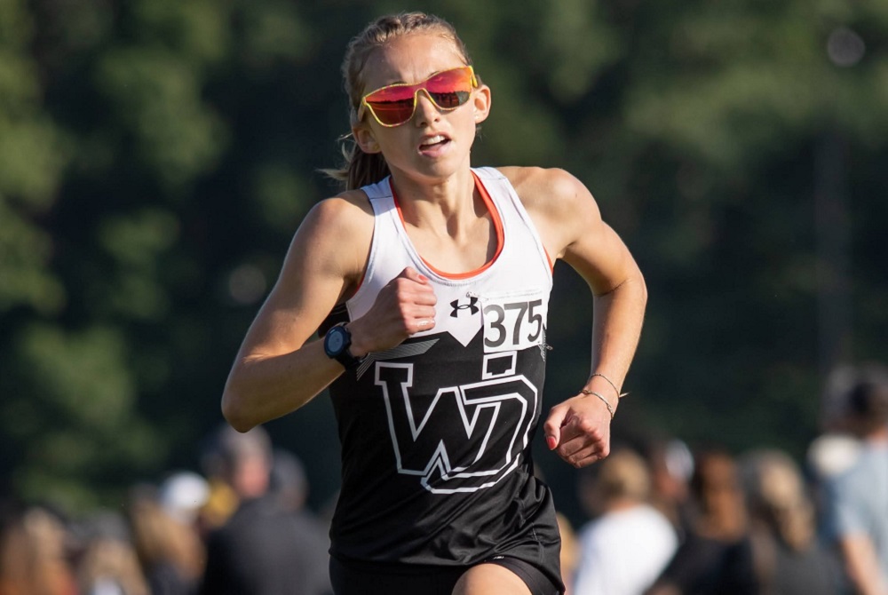 Holland West Ottawa's Helen Sachs charges to the lead during a race this fall.