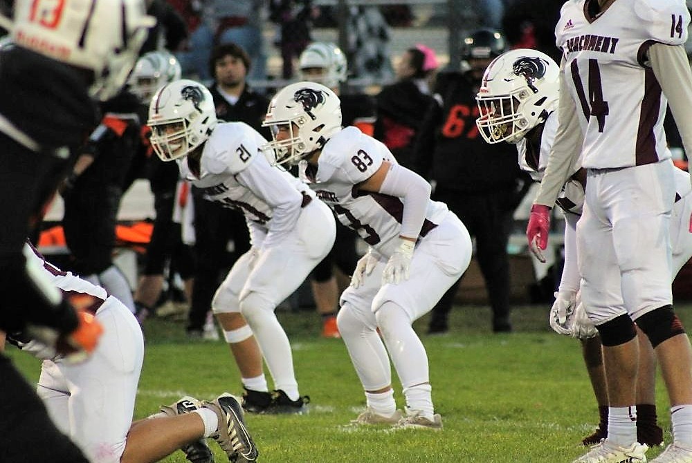 Parchment’s Jacob Guzior (83) prepares to defend from his linebacker spot during a 21-17 Week 7 win over Allegan. 