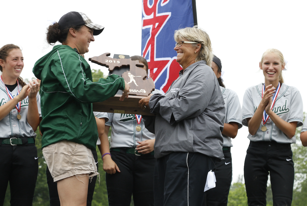 Wayland softball coach Cheri Ritz, front right, accepts the Division 2 championship trophy in 2015.