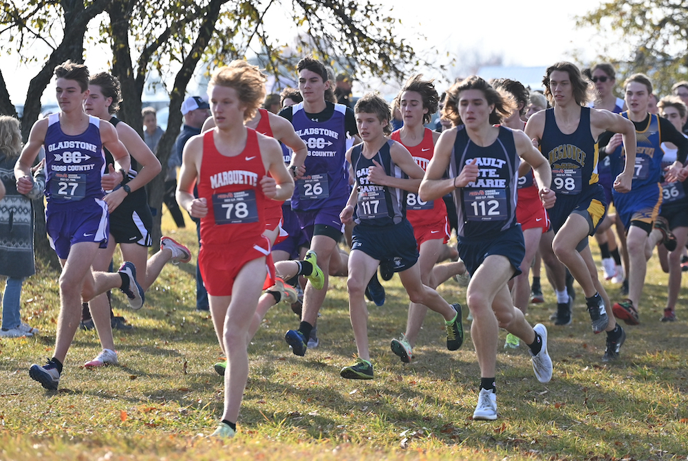 Gladstone's Drew Hughes (27), Marquette's Carson VanderSchaaf (78), Gladstone's Aaron Hughes (26), Sault Ste. Marie's Gabe Litzner (117) and Cody Aldridge (112), and Negaunee's Judge Anderson (98) lead the start of Saturday’s Upper Peninsula Division 1 Final. 