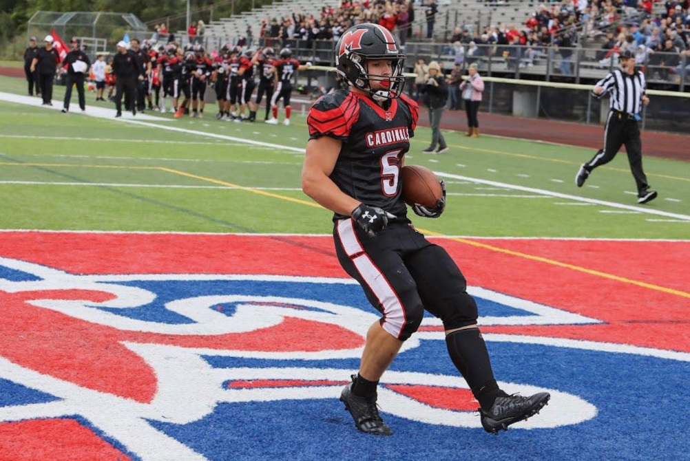 Cardinal Mooney’s Brendan Haisenleder finishes one of his 30 touchdowns this fall. 