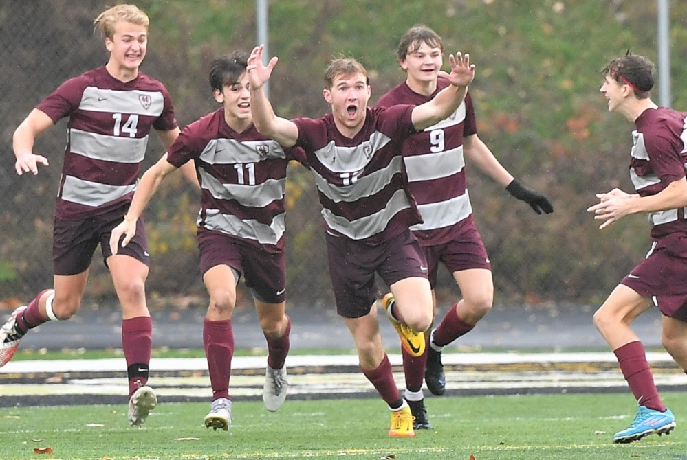 Derek Huisman, center, and his teammates celebrate his goal during the Division 3 Final.