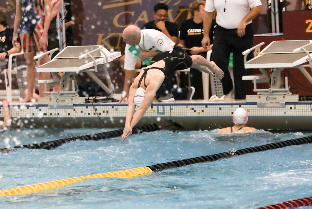 An East Grand Rapids swimmer leaves the blocks during the 400 freestyle relay.