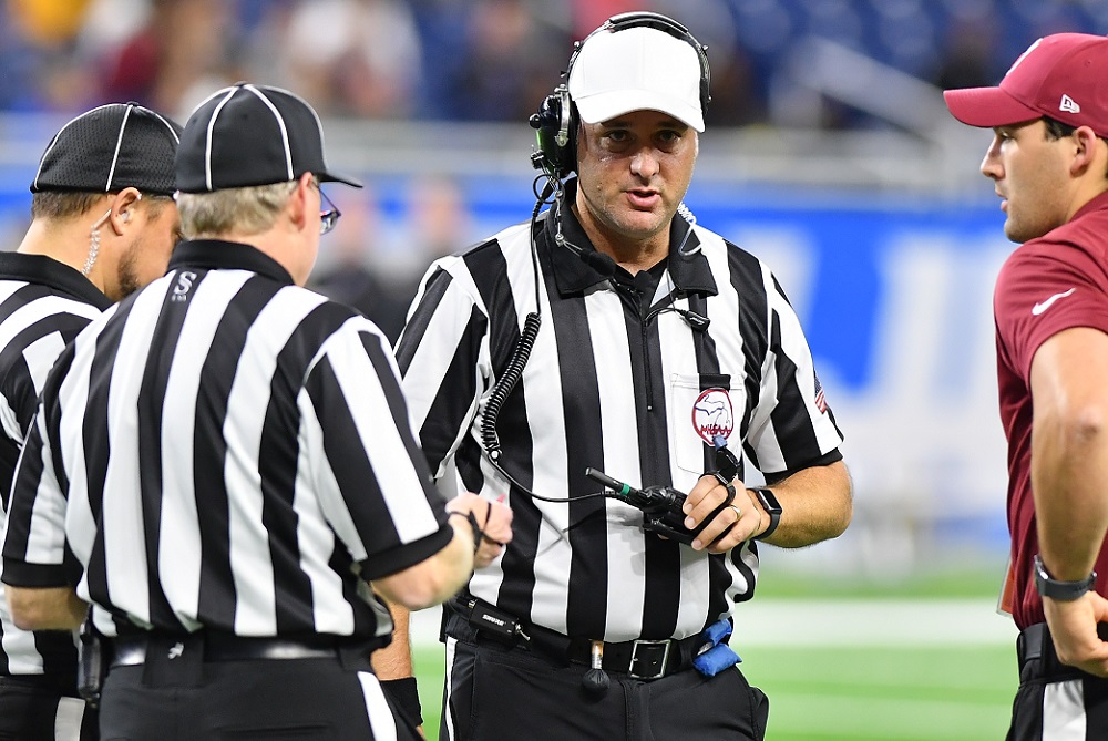 Officials talk things over during the 2019 Division 5 Final.