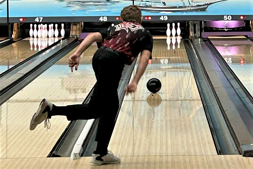 Holton's Tuff Scott rolls for a spare during a match this week. 