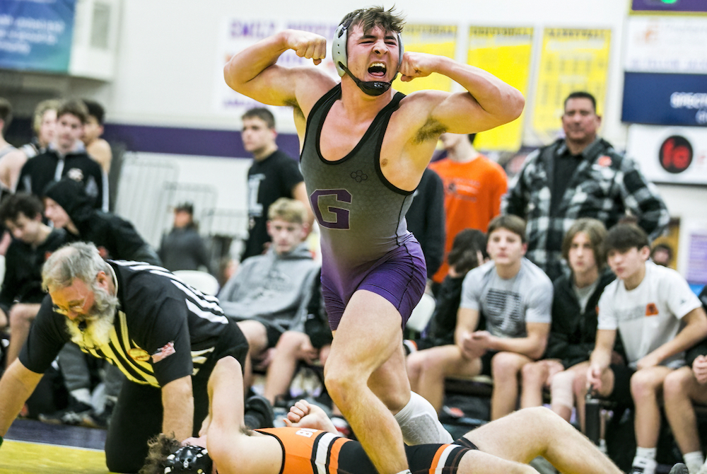 Greenville wrestler Isaac Daily celebrates a win during a match this season. 