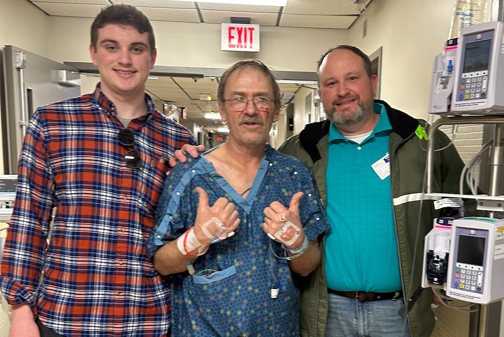 From left: Wilson Shinske, Jerry and Steve Shinske meet Monday, two days after the father and son helped save Jerry’s life on I-75. 