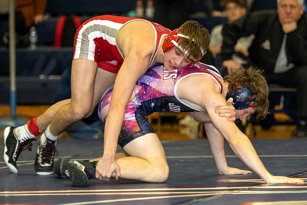 Temperance Bedford’s Brock Jandasek wrestles Westland John Glenn’s Kyle Wilson in a Division 1 Individual District championship match Feb. 11.