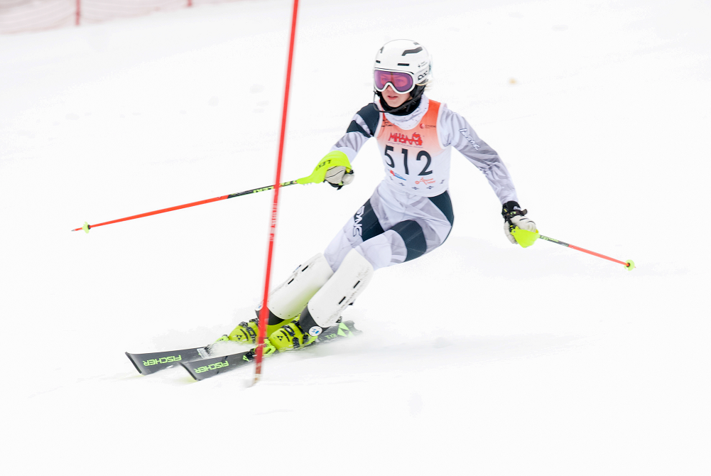 Petoskey’s Marley Spence speeds through one of her runs on the way to winning both individual championships Monday.