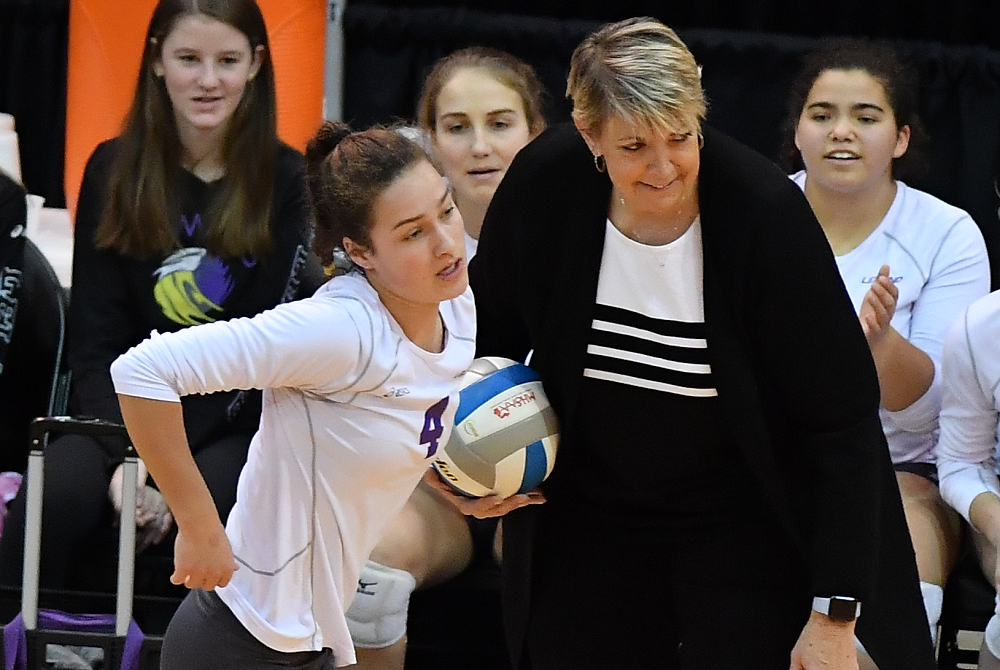 Leland coach Laurie Glass confers with one of her players during the 2019 Division 4 Final at Kellogg Arena. 