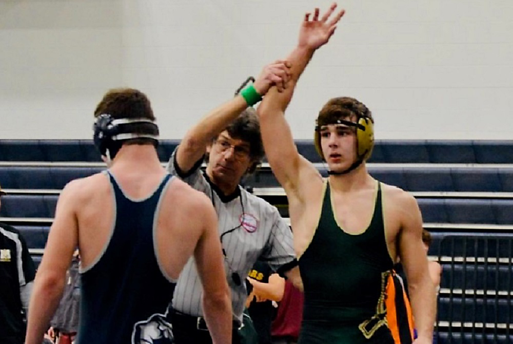 Easten Cook’s arm is raised in victory after a match this season.