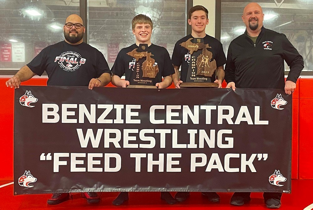 From left: Benzie Central co-coach Cody Vandonkelaar, Wyatt Noffsinger, Austin Smith and co-coach Josh Lovendusky show off the program’s hardware won this winter.