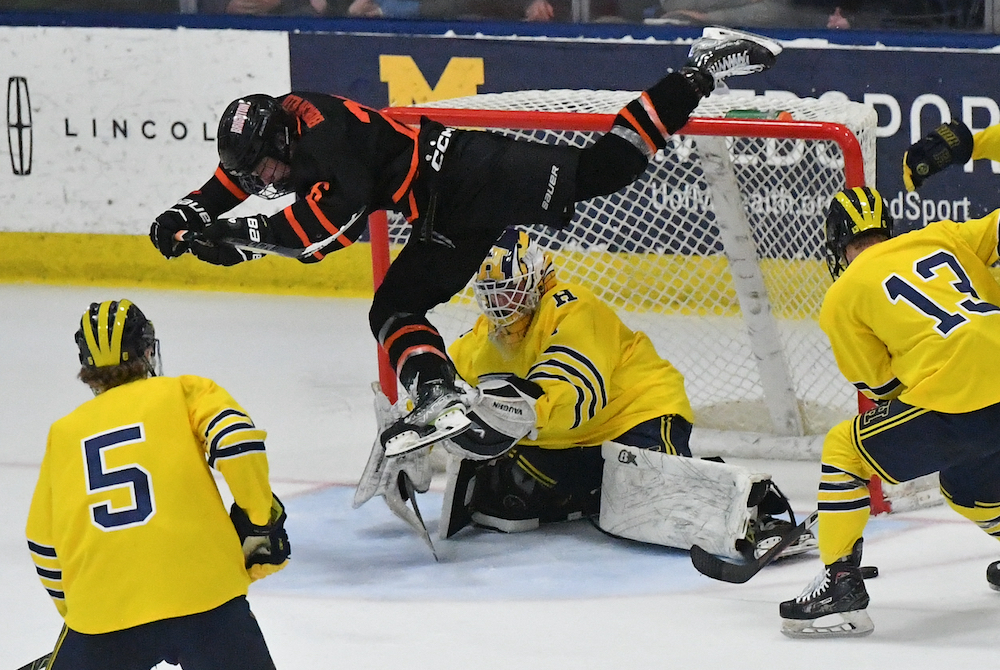 Brighton’s Charlie Burchfield nearly flies over the goal after getting stopped during the third period of his team’s win over Hartland.