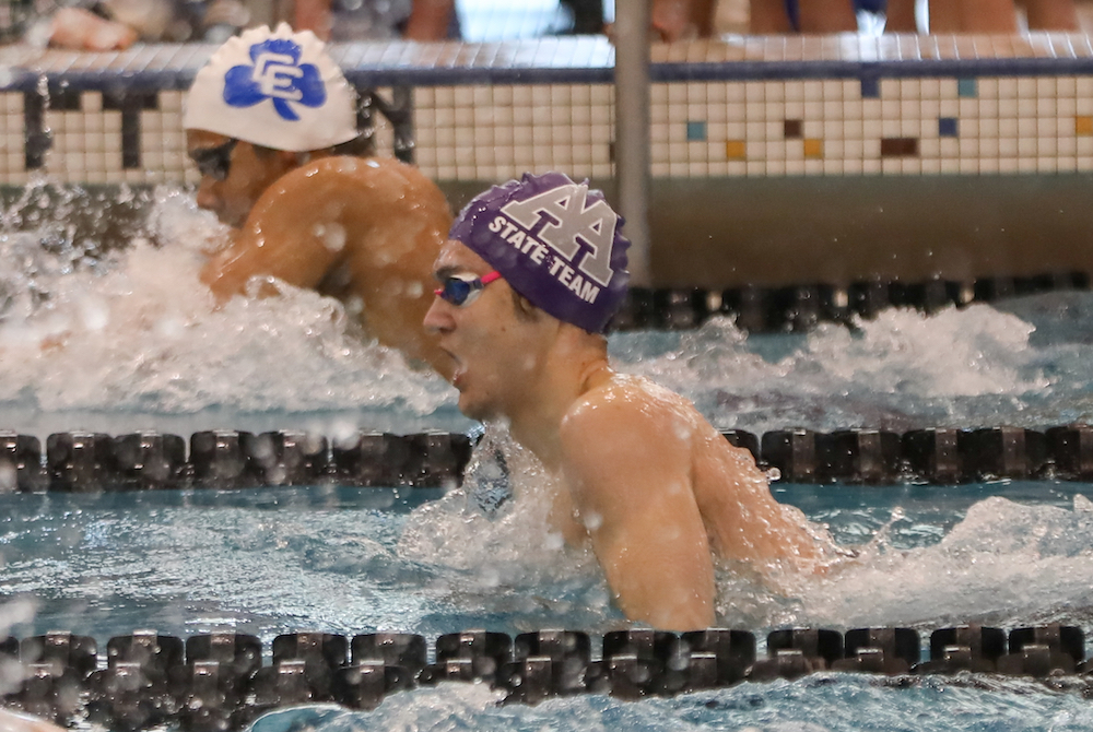 Ann Arbor Pioneer's Henry Baumhover and Detroit Catholic Central's Christopher Leuciuc race in the 200 IM.