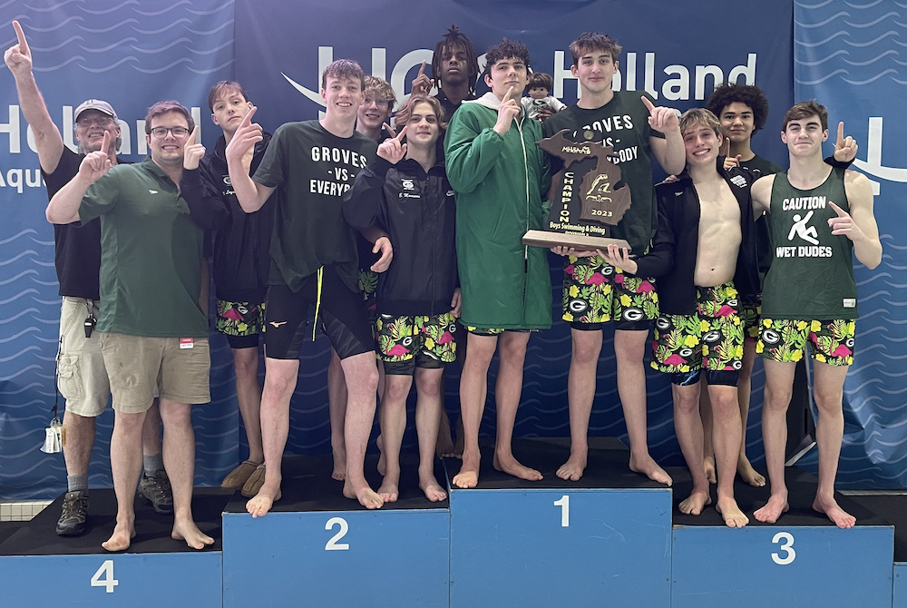 Birmingham Groves celebrates its LPD2 team championship Saturday at Holland Aquatic Center.