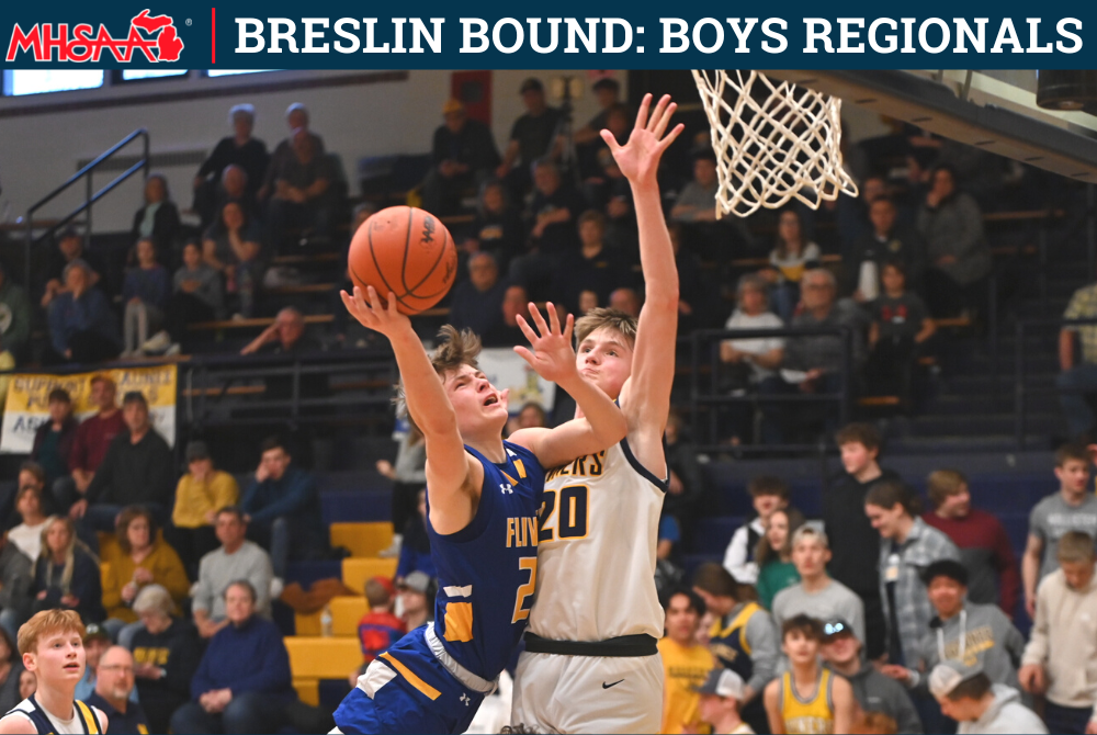 Kingsford's Gavin Grondin (23) goes up for a shot last week while defended by Negaunee's Brodin Bell (20). 