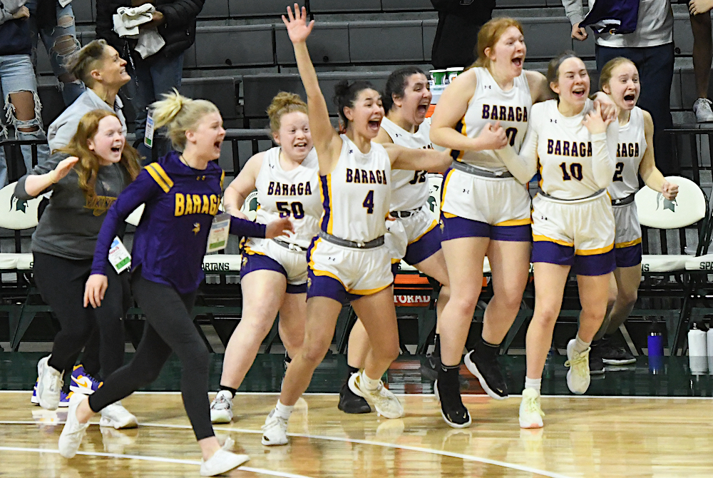 Baraga players begin to celebrate their team’s 46-44 win over Fowler on Thursday at Breslin Center.