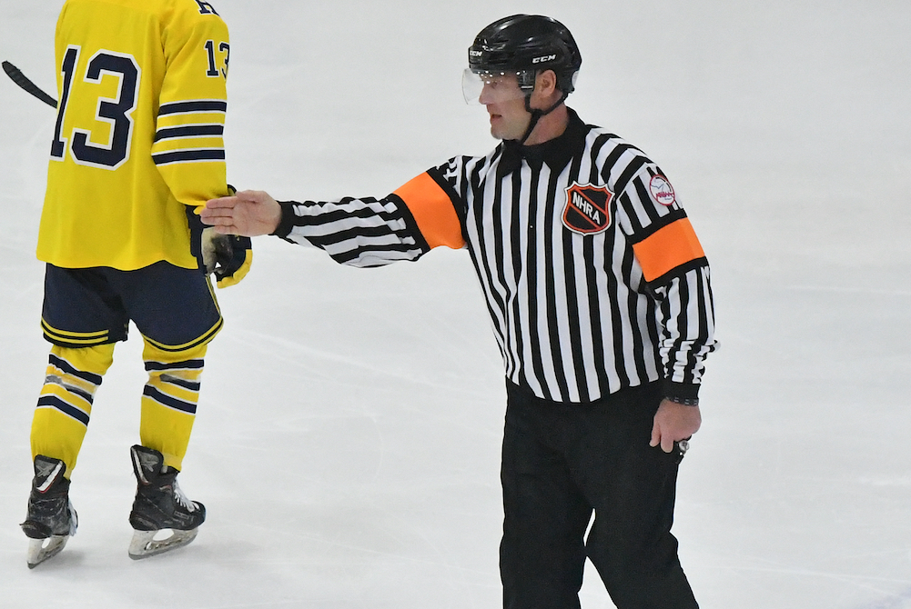 MHSAA official Bryan Smolinski signals during Friday's Division 1 Semifinal between Brighton and Hartland. 