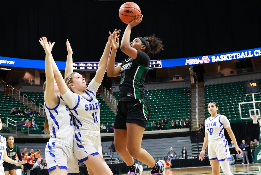West Bloomfield's Kendall Hendrix gets up a shot during Friday's first Division 1 Semifinal at Breslin Center, with Salem's Abby Resovsky defending. 