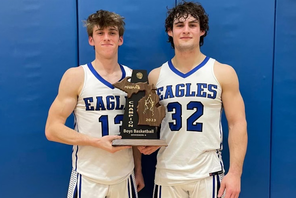 St. Mary’s seniors Dylan Barnowski, left, and Shawn Brammer hold up the team’s District championship trophy last week. 