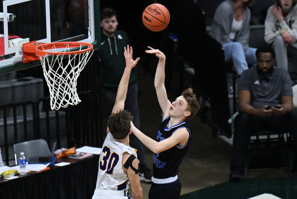 Tri-unity’s Jordan VanKlompenberg (3) puts up a shot over the outstretched arm of Frankfort’s Xander Sauer on Thursday. 
