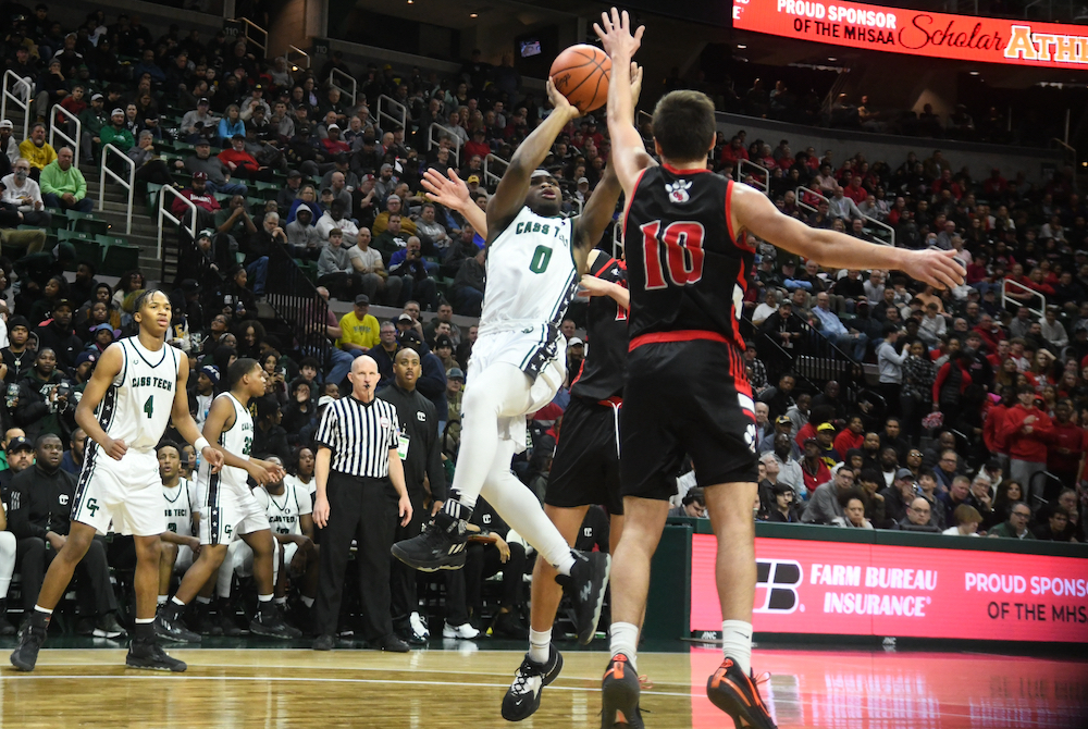 Detroit Cass Tech’s Corey Sadler Jr. (0) gets up a shot during his team’s Division 1 Semifinal overtime win Friday. 