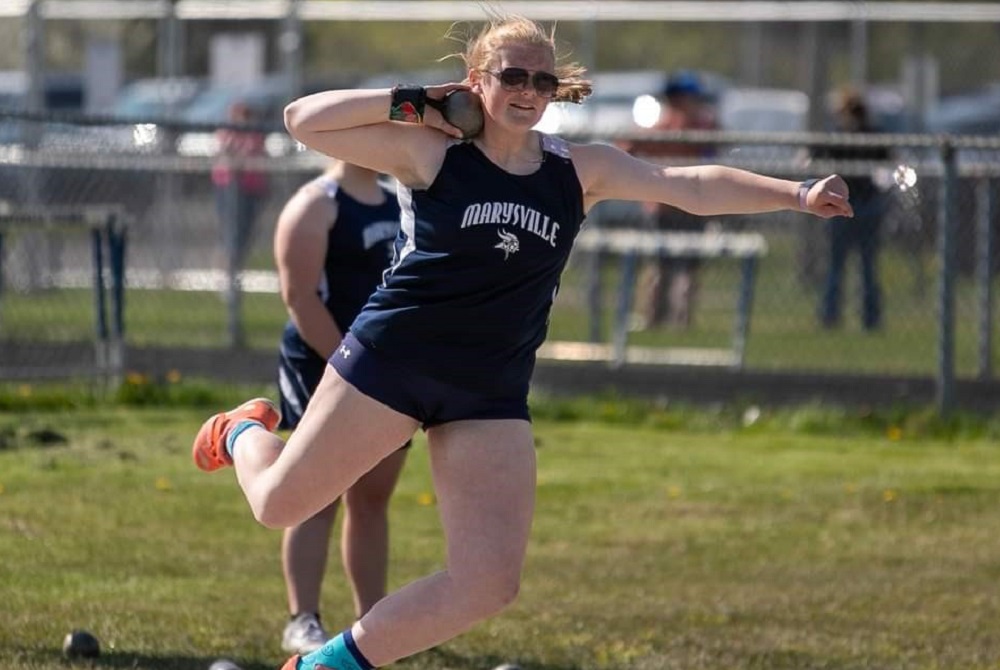 Marysville’s Janae Hudson unwinds while putting the shot during a meet.