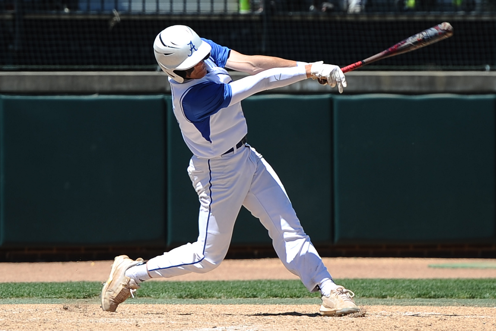 Beal City standout Cayden Smith drives a pitch during last season’s Division 4 Final against Riverview Gabriel Richard.