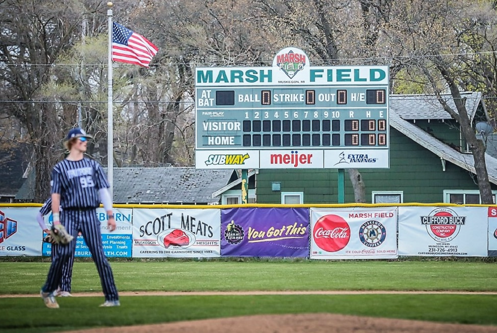 Fruitport 6-foot-8 sophomore Ryan Bosch, who recently committed to the University of Michigan as a pitcher, warms up at Muskegon's historic Marsh Field before a game in the "Friday Night Lights" series April 28. 