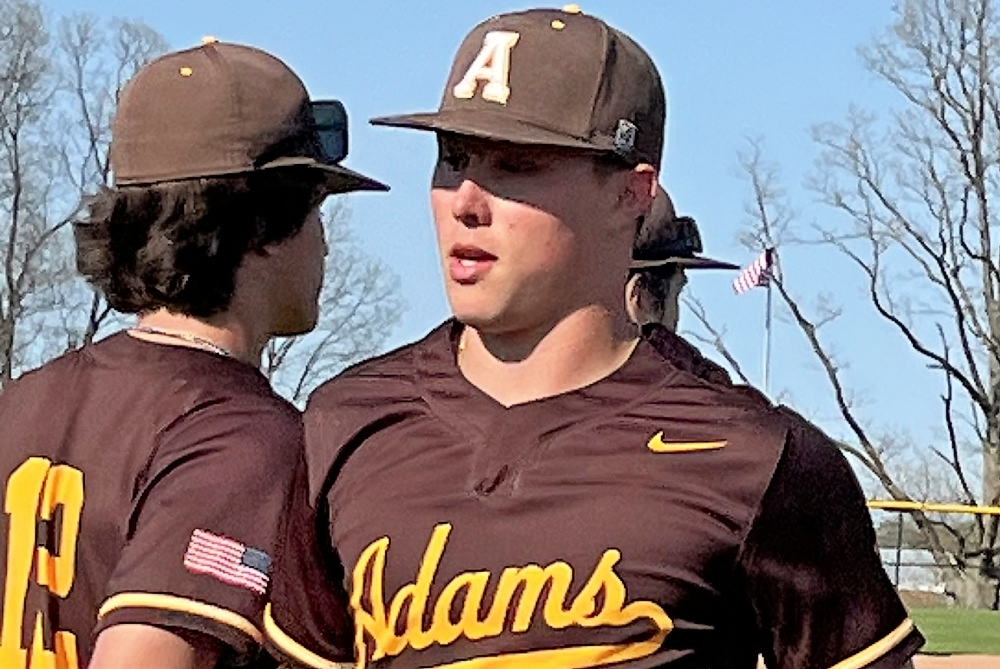 Rochester Adams’ Parker Picot comes to the dugout during a game against Lake Orion on May 9.