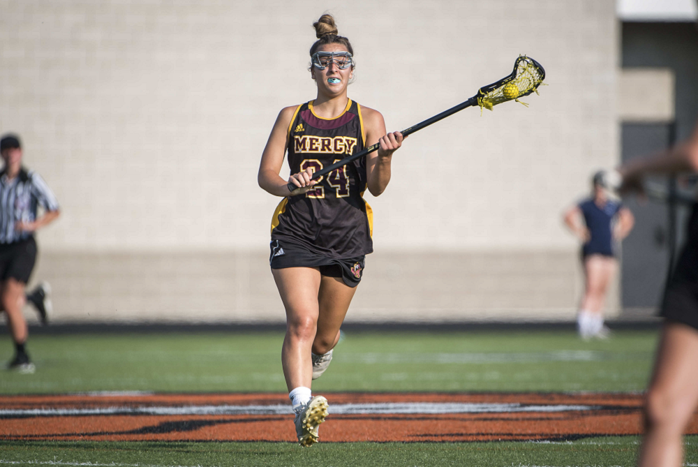 Farmington Hills Mercy's Jillian Smith directs the attack during her team's 2021 Semifinal against Bloomfield Hills Cranbrook Kingswood. 