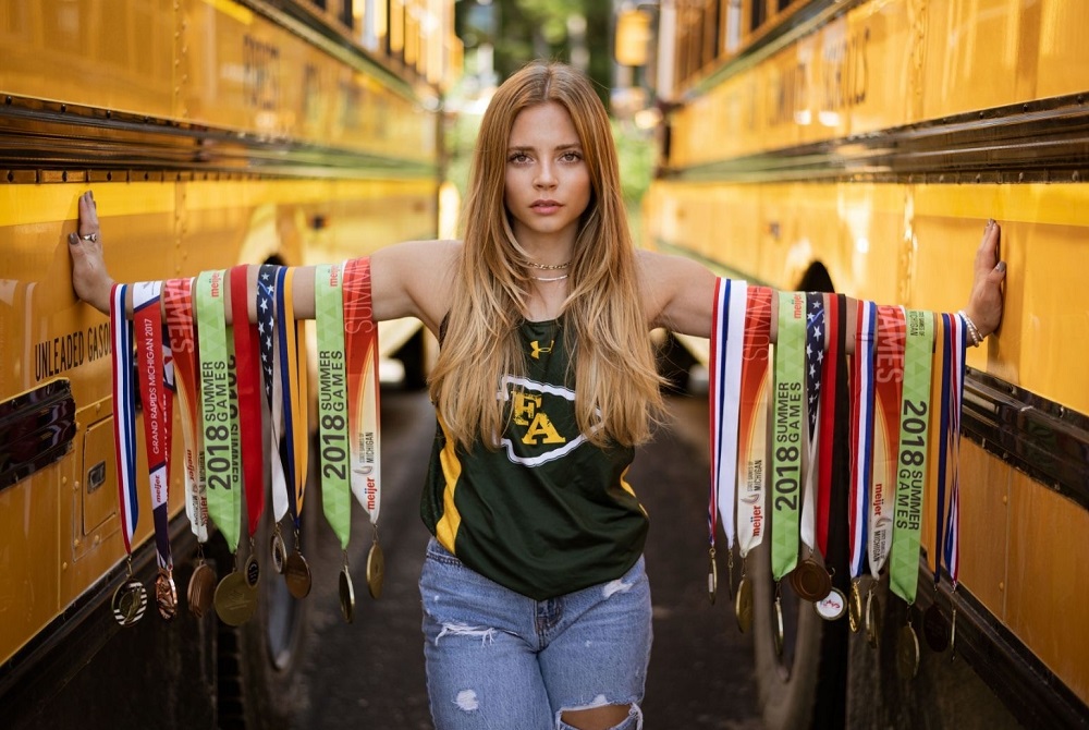 Forest Area’s Meagan Lange shows some of the many medals she’s received for her running achievements.