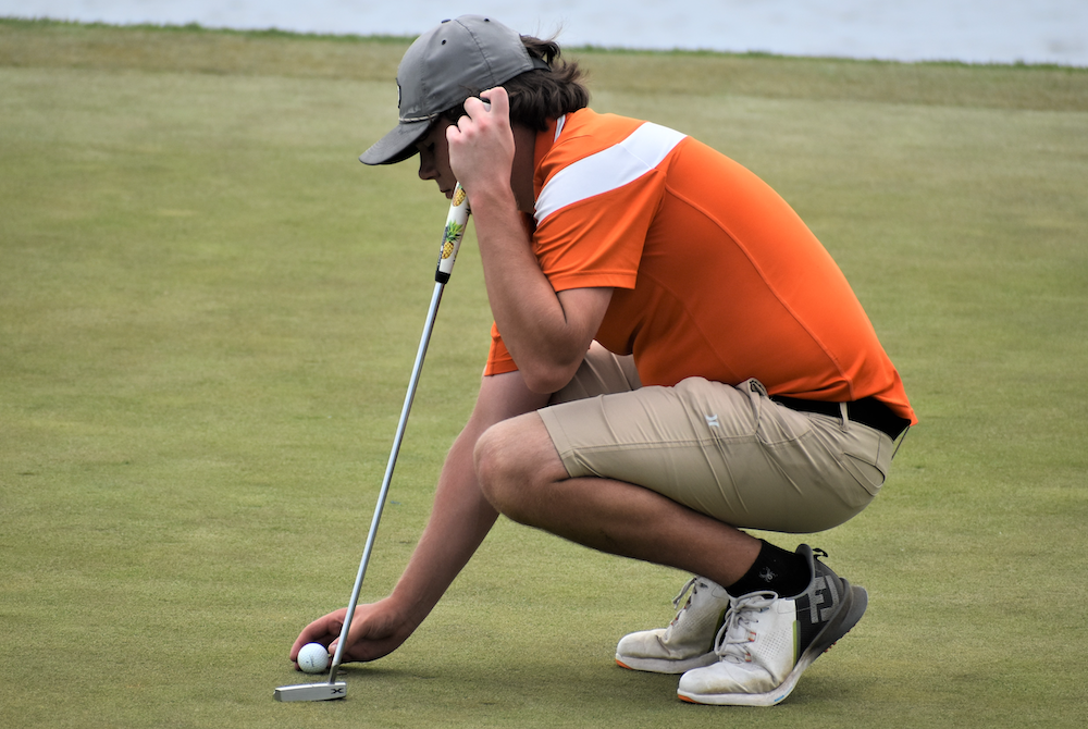 Houghton’s Marino Pisani lines up a putt during his round Wednesday at Sweetgrass.