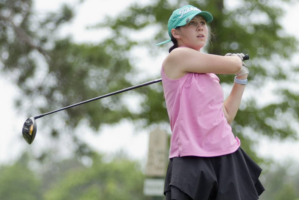 Manistique’s Nora Cunningham tees off during her round Wednesday at Oak Crest.