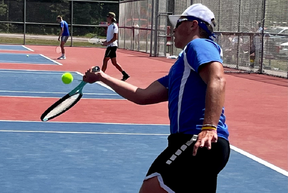 Ishpeming's Hayden Hares returns a volley at No. 1 doubles during Tuesday’s UP Division 2 Finals at Westwood. 