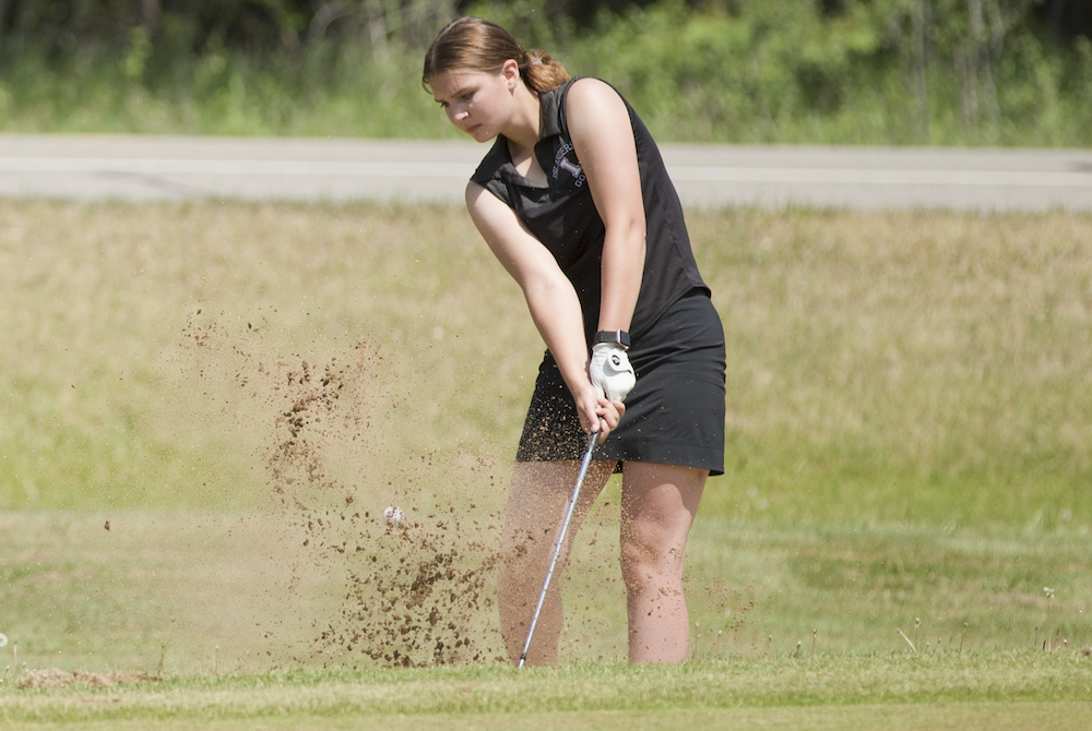 Cedarville/DeTour’s Lily Plowman hits out of the sand during Thursday’s UPD3 Final.