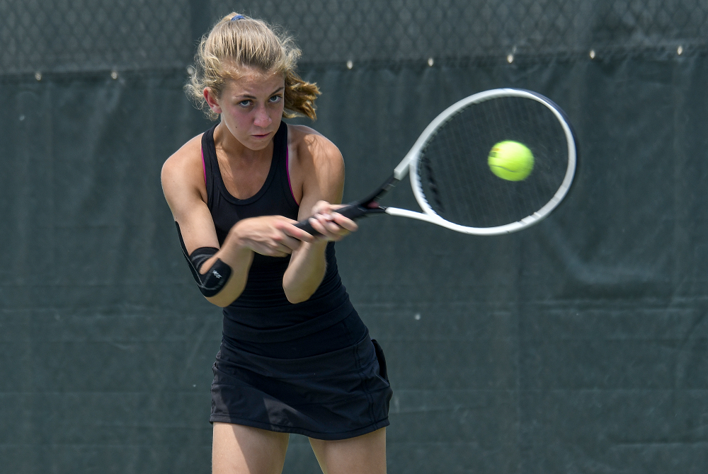 Birmingham Seaholm’s Courtney Marcum fires a backhand during a No. 2 singles match Saturday at Midland Tennis Center.