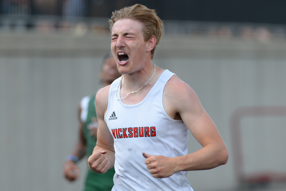 Vicksburg's Michael Wright celebrates after winning the 200 on Saturday.