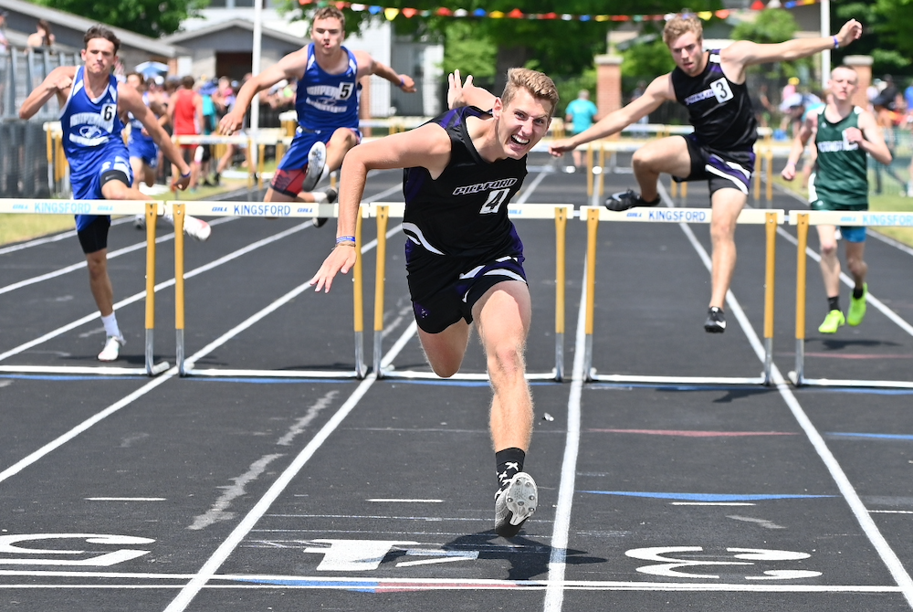 Pickford’s David Kozisek crosses the finish line first in the 300 hurdles Saturday. 