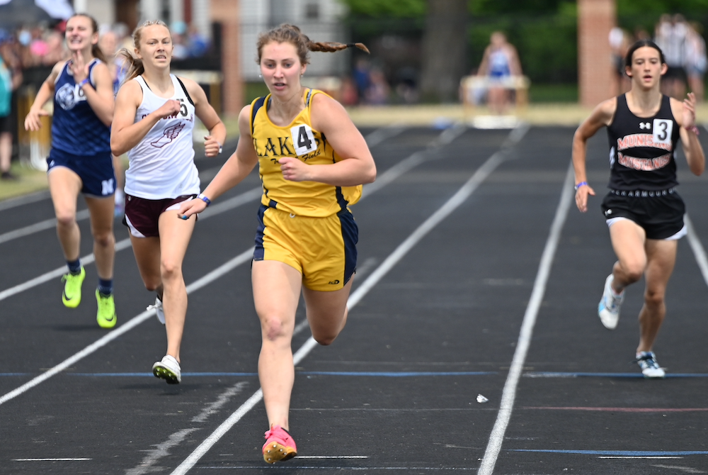Lake Linden-Hubbell's Emily Jokela, second from right, wins the 400 on Saturday.