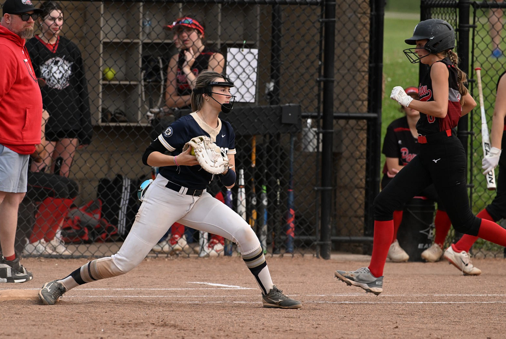 Otsego gets a runner out at first base during a District game. 