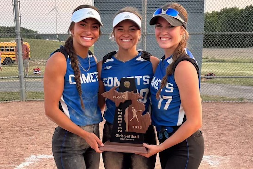 From left, Coleman’s Nevaeh Chaffee, Madison Miller and Ava Gross show their team’s District softball trophy won Friday at Beal City.