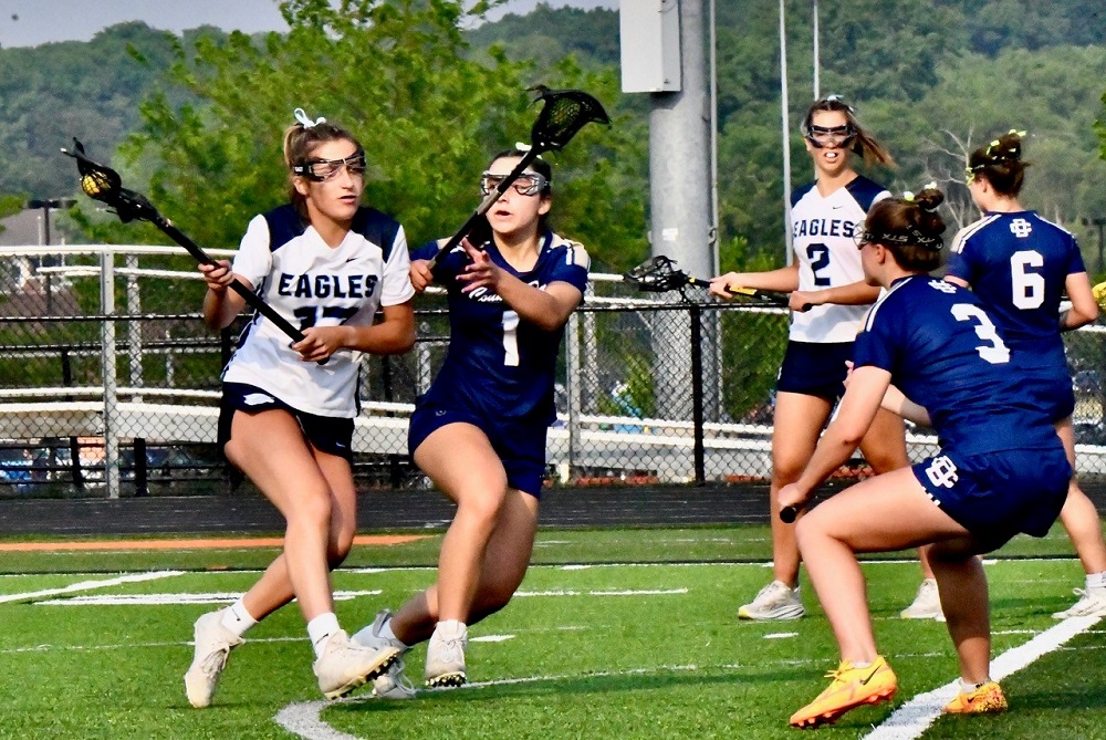 Detroit Country Day’s Alessia Sessa (1) defends during Wednesday's Semifinal win over Ann Arbor Skyline and Lilly Shannon (17).