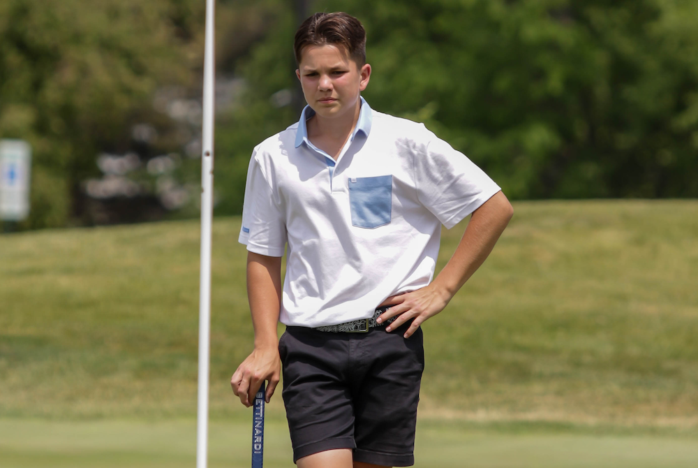 Grand Rapids Christian’s Cooper Reitsma looks over a putt during Saturday’s second round at The Fortress.