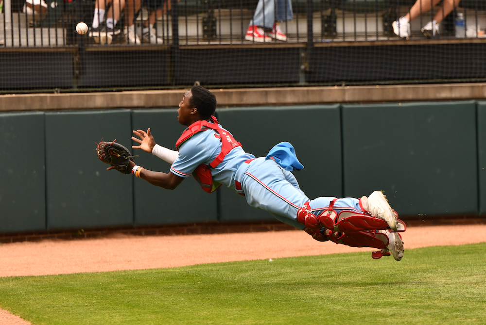 University Liggett catcher Oliver Service lays out to get to a foul ball Friday at McLane Stadium. 