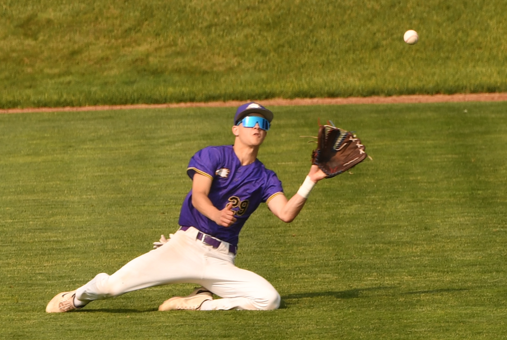Plymouth Christian Academy’s Micah Lavigne lays out in pursuit of a drive to center field Thursday. 